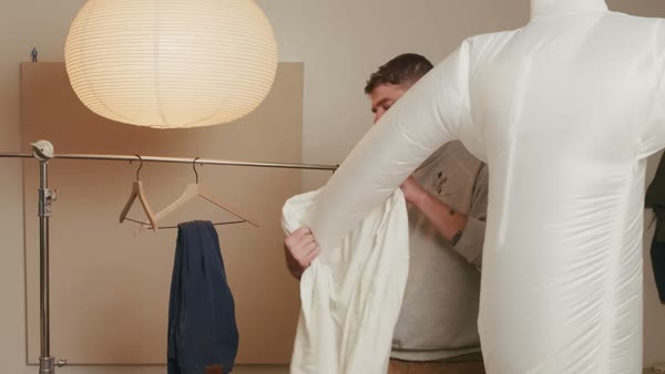 Bellyron Hands-Free Ironing Machine, still from the video